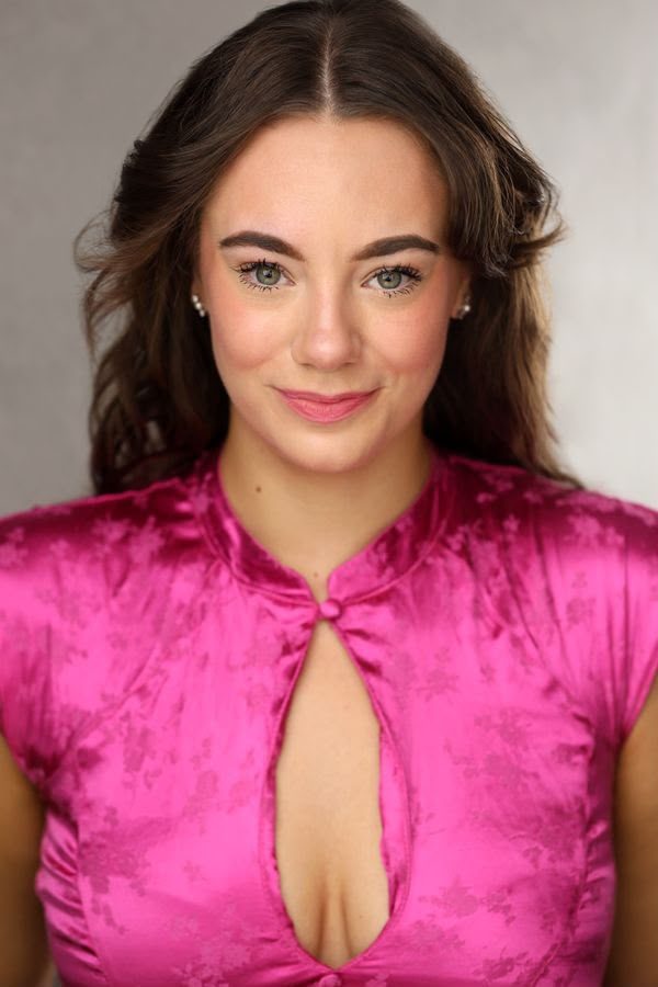 Headshot of Topaz in a pink top